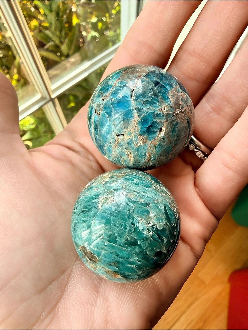 Two polished blue apatite spheres